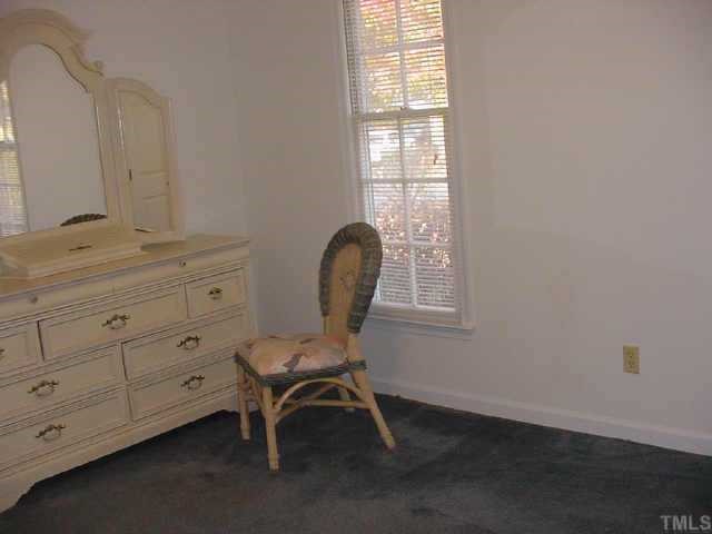 2216 Carthage Circle Raleigh, NC 27604 - Photo 4 of 11 a view of a workspace with furniture and a window