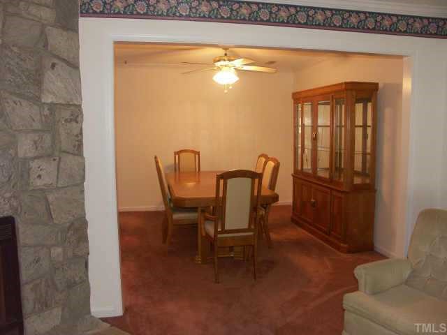 2216 Carthage Circle Raleigh, NC 27604 - Photo 5 of 11 a view of a dining room with furniture and window