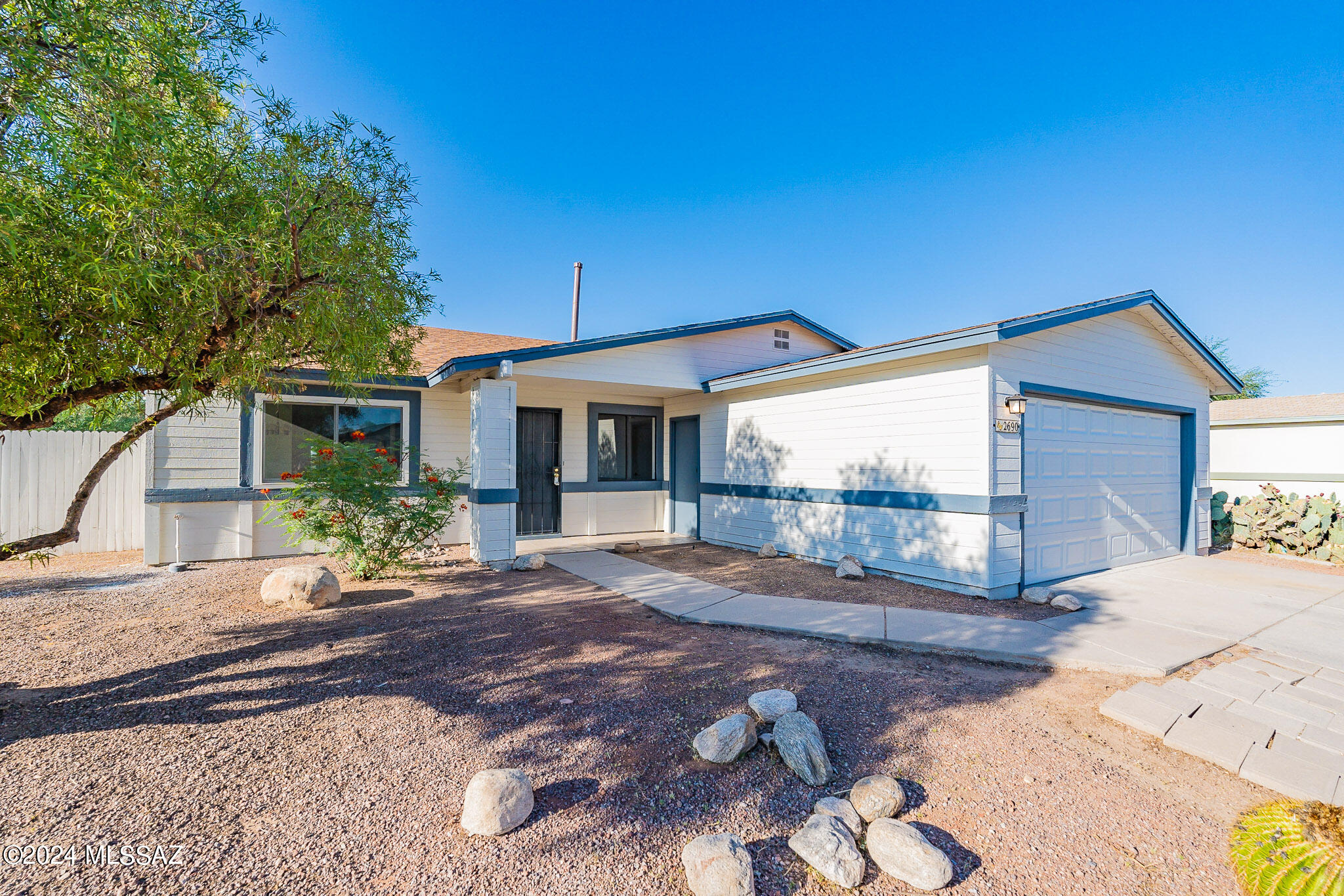 2690 West Sunset Road Tucson, AZ 85741 - Photo 1 of 33 a view of a house with backyard and sitting area