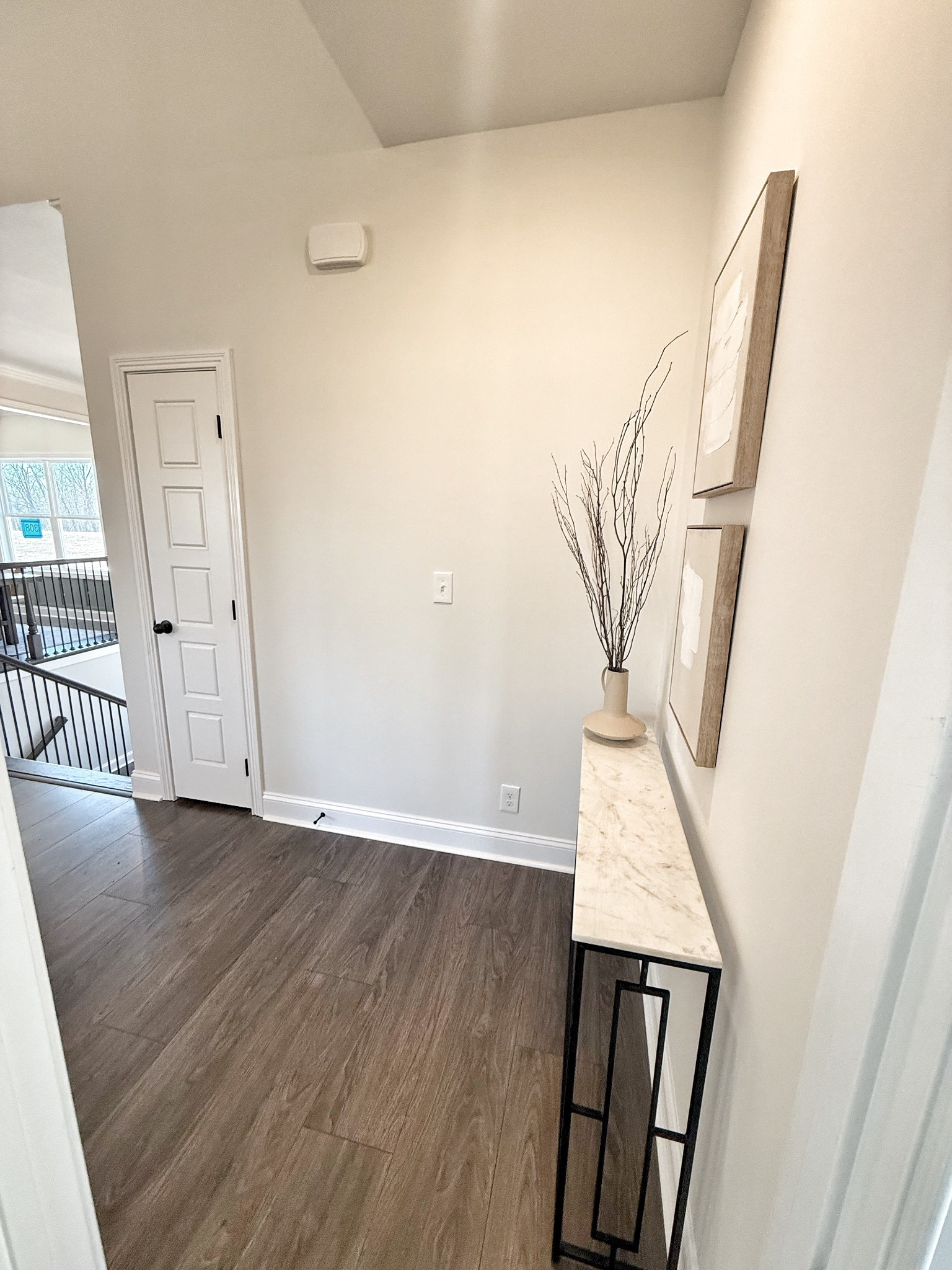 865 Burley Barn Road Clarksville, TN 37042 - Photo 16 of 44 an empty room with wooden floor and entrance