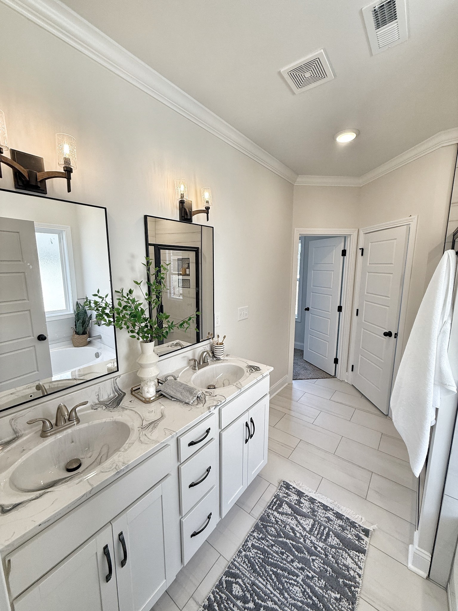865 Burley Barn Road Clarksville, TN 37042 - Photo 21 of 44 a spacious bathroom with a double vanity sink mirror and shower