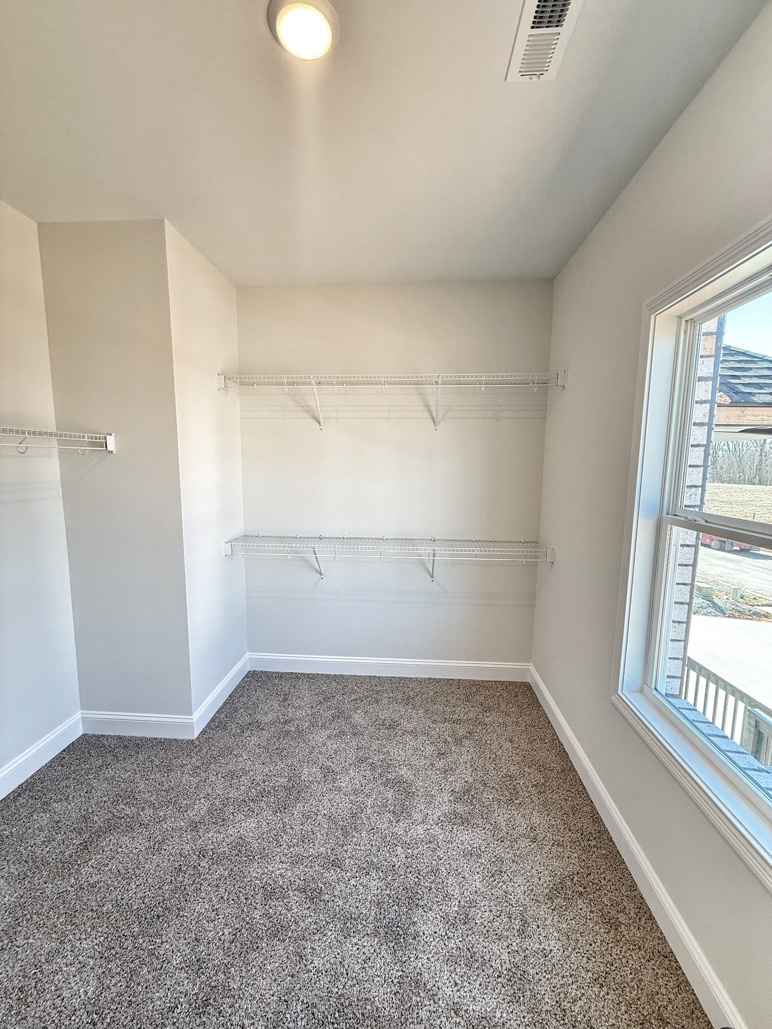 865 Burley Barn Road Clarksville, TN 37042 - Photo 26 of 44 wooden floor in an empty room with a window