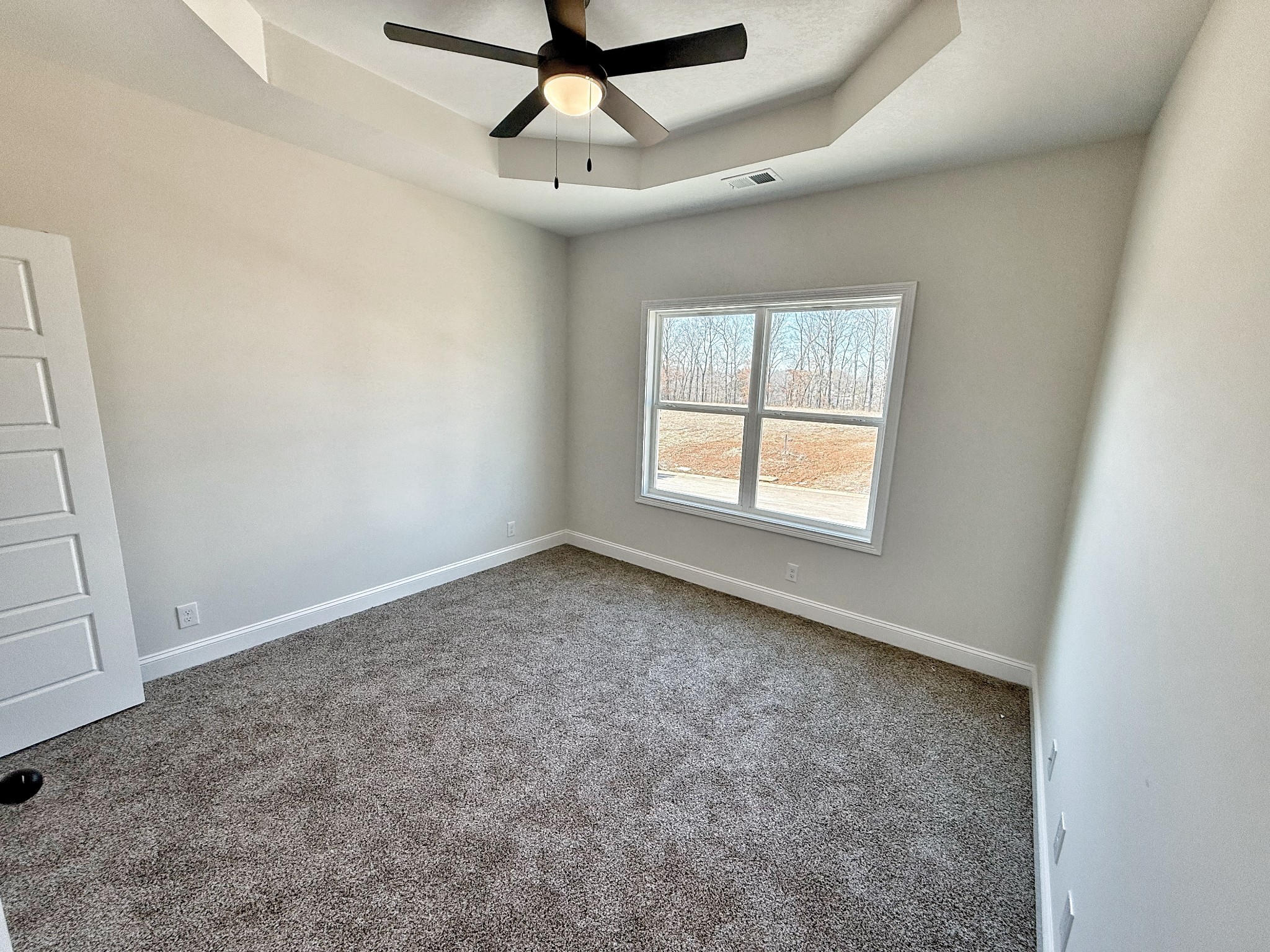 865 Burley Barn Road Clarksville, TN 37042 - Photo 28 of 44 an empty room with a ceiling fan and window
