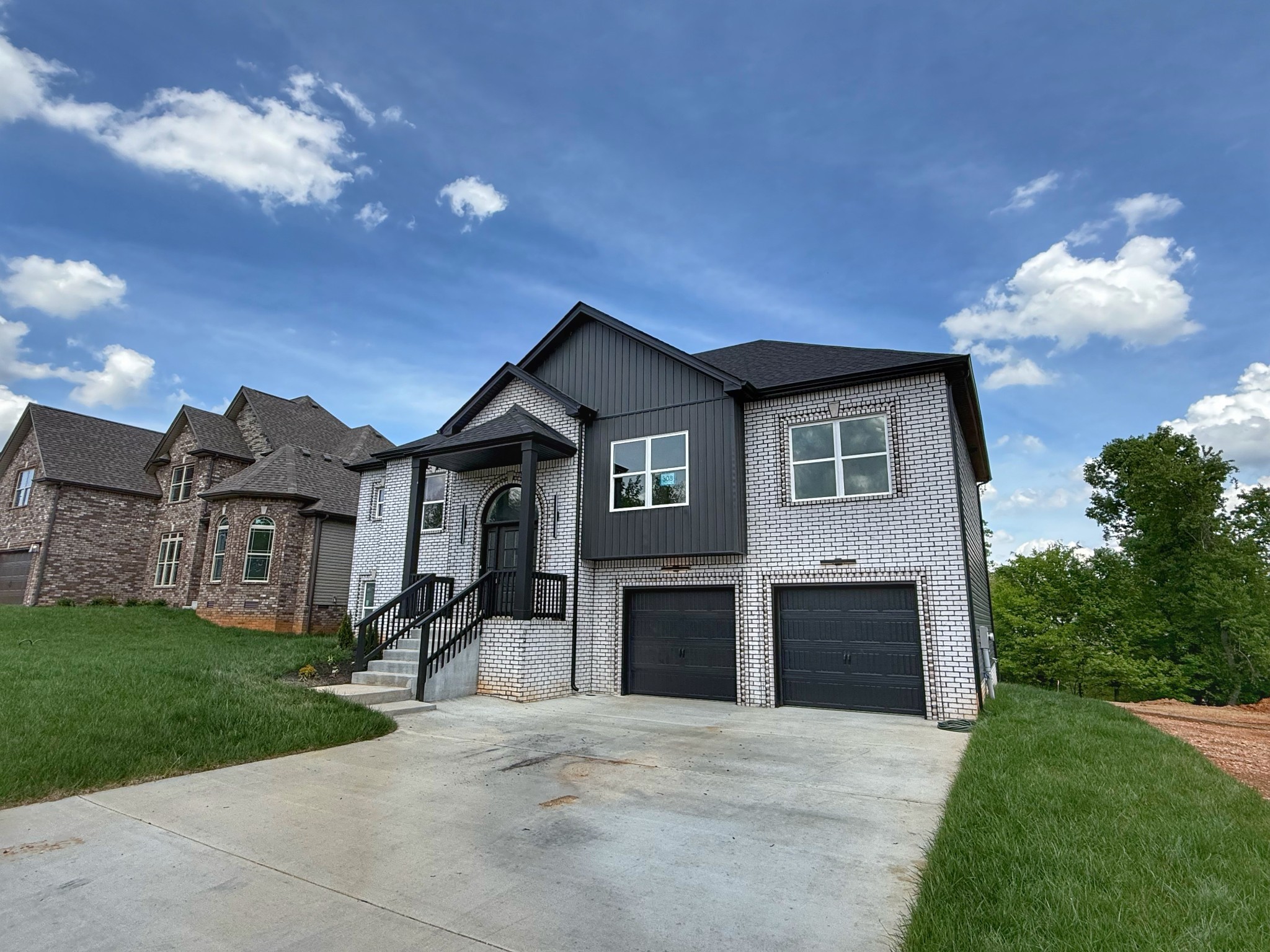 865 Burley Barn Road Clarksville, TN 37042 - Photo 3 of 44 a front view of a house with a yard and garage