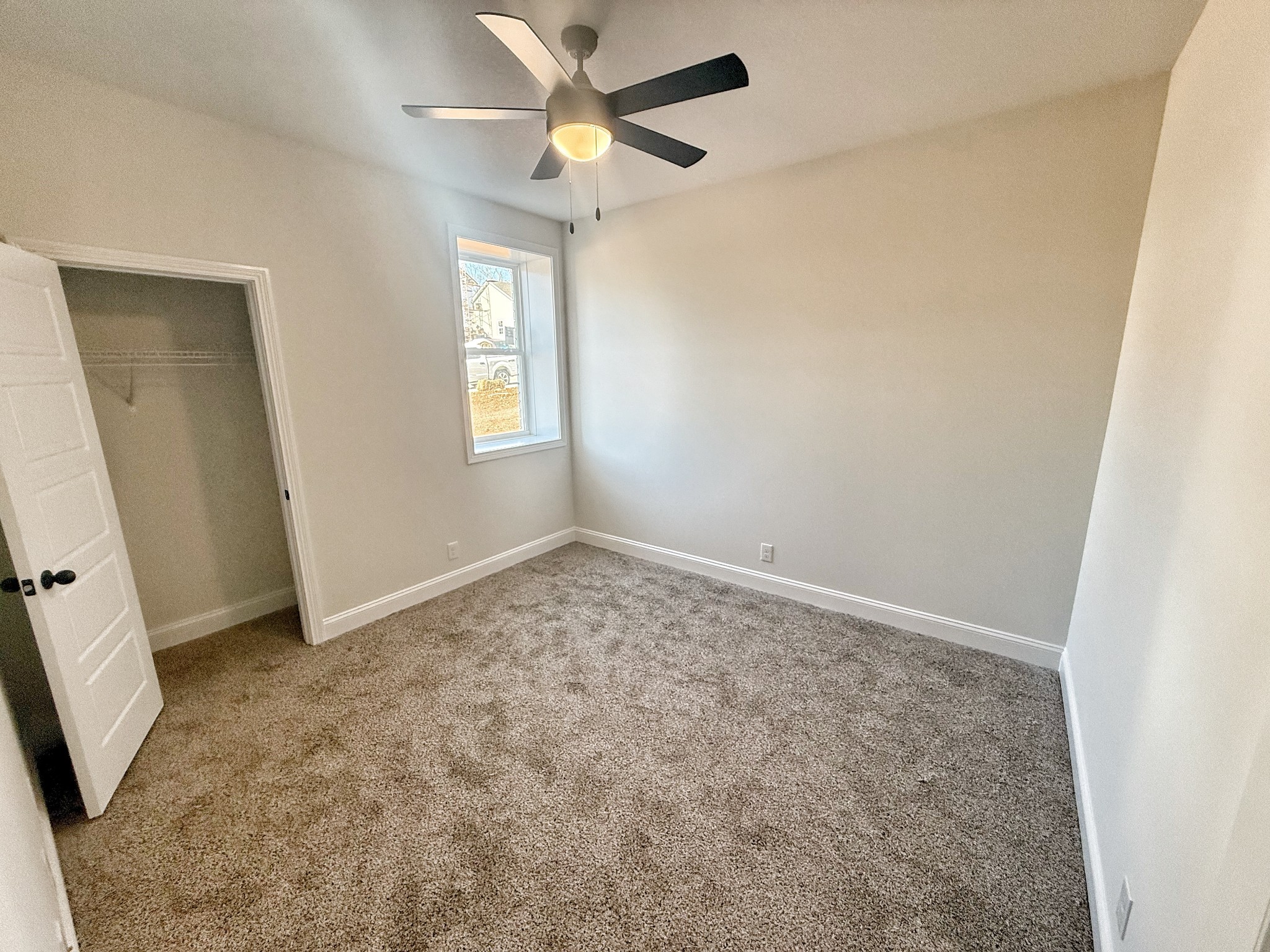 865 Burley Barn Road Clarksville, TN 37042 - Photo 36 of 44 an empty room with windows and fan