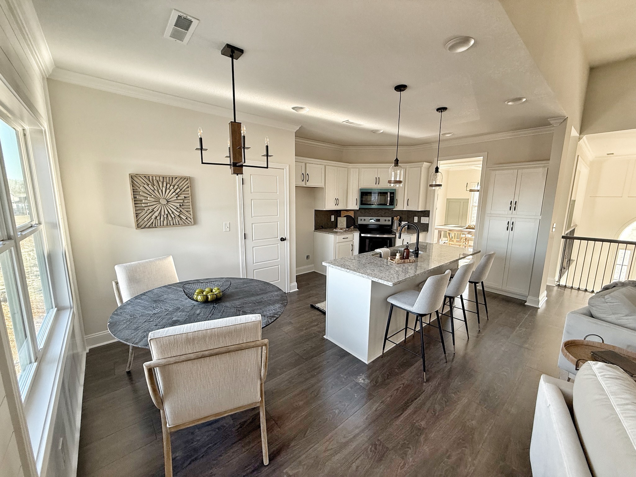 865 Burley Barn Road Clarksville, TN 37042 - Photo 9 of 44 a kitchen and a dining table chairs