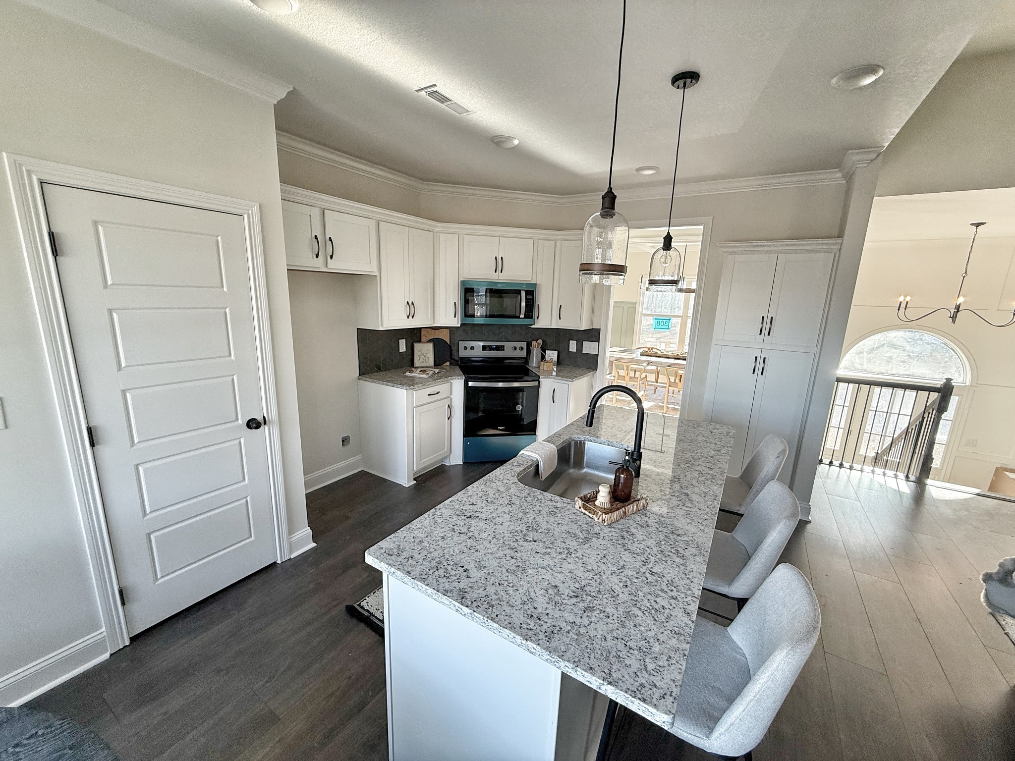 865 Burley Barn Road Clarksville, TN 37042 - Photo 10 of 44 a kitchen with stainless steel appliances granite countertop a stove refrigerator and a wooden floors