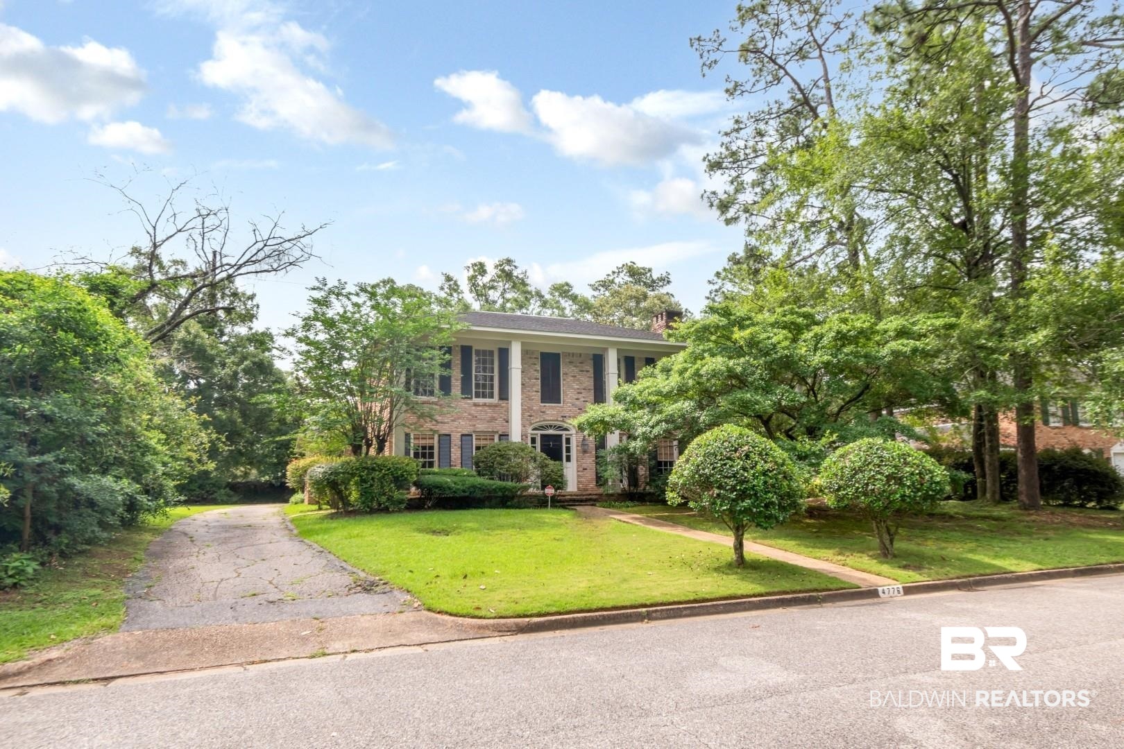 4776 Falls Church Road Mobile, AL 36608 - Photo 2 of 45 Brick facade residence with two-story columns and dark shutters
