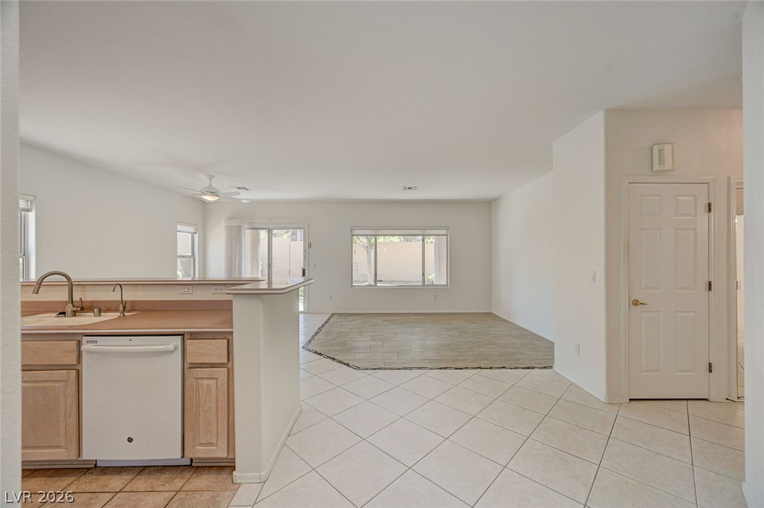 2529 Springville Way Henderson, NV 89052 - Photo 5 of 70 Clean-lined tile flooring flows seamlessly through this open-concept layout.