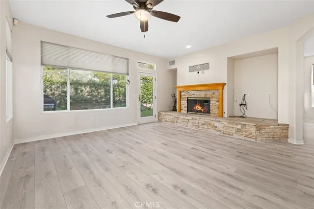 a view of a kitchen and an empty room