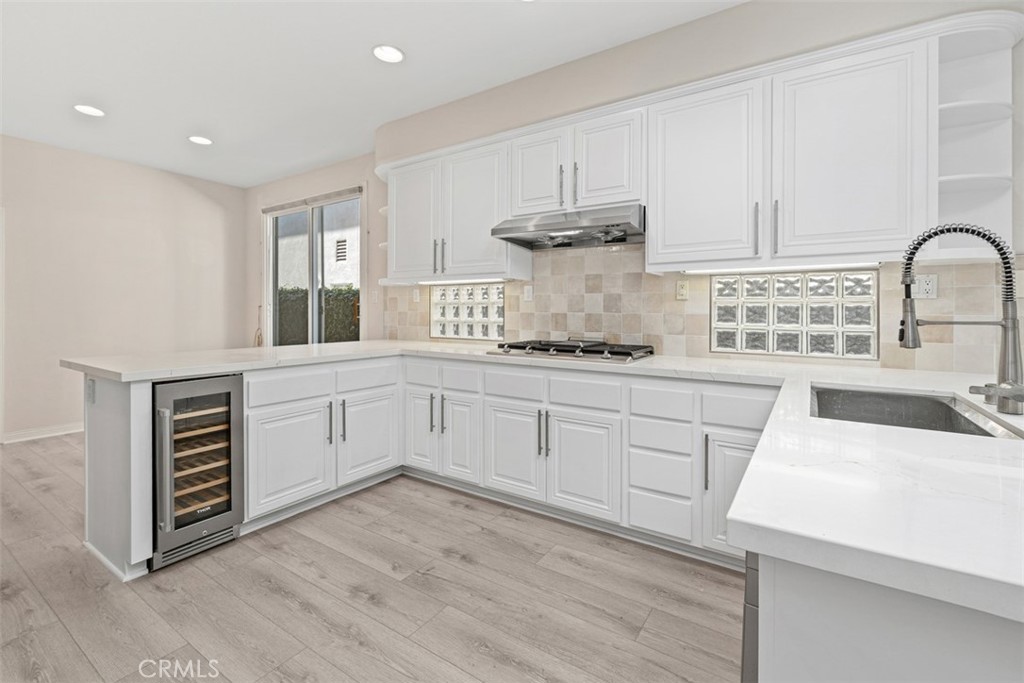 27806 Homestead Road Laguna Niguel, CA 92677 - Photo 18 of 52 a kitchen with stainless steel appliances a white stove top oven and sink