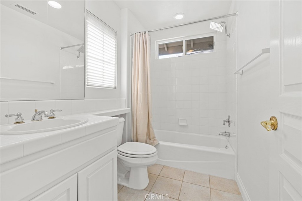 27806 Homestead Road Laguna Niguel, CA 92677 - Photo 30 of 52 a bathroom with a toilet a sink and bathtub