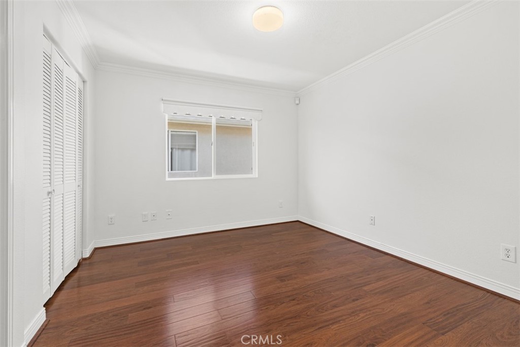 27806 Homestead Road Laguna Niguel, CA 92677 - Photo 31 of 52 an empty room with wooden floor and windows