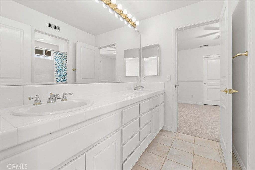 27806 Homestead Road Laguna Niguel, CA 92677 - Photo 32 of 52 a bathroom with a double vanity sink mirror and