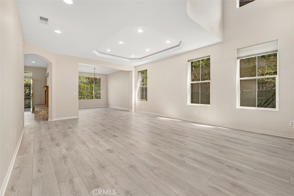 27806 Homestead Road Laguna Niguel, CA 92677 - Photo 8 of 52 a view of an empty room with wooden floor and a window