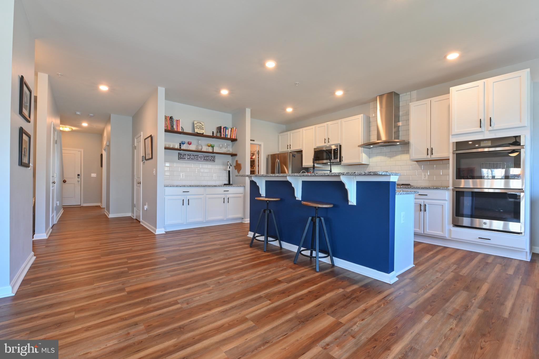 5559 Trafalgar Circle Tilghman, MD 21671 - Photo 13 of 62 a view of kitchen with wooden floor and electronic appliances