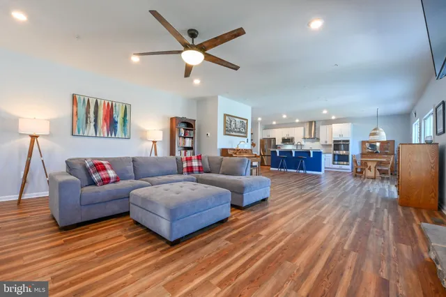 a living room with fireplace furniture and a flat screen tv