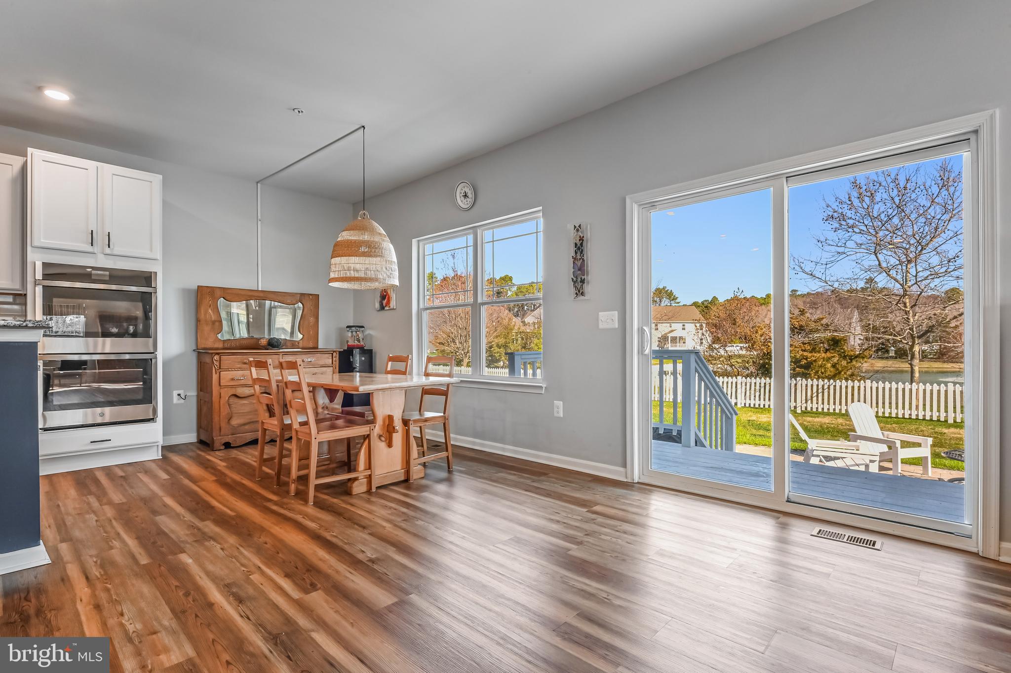 5559 Trafalgar Circle Tilghman, MD 21671 - Photo 22 of 62 a view of a dining room with furniture window and wooden floor