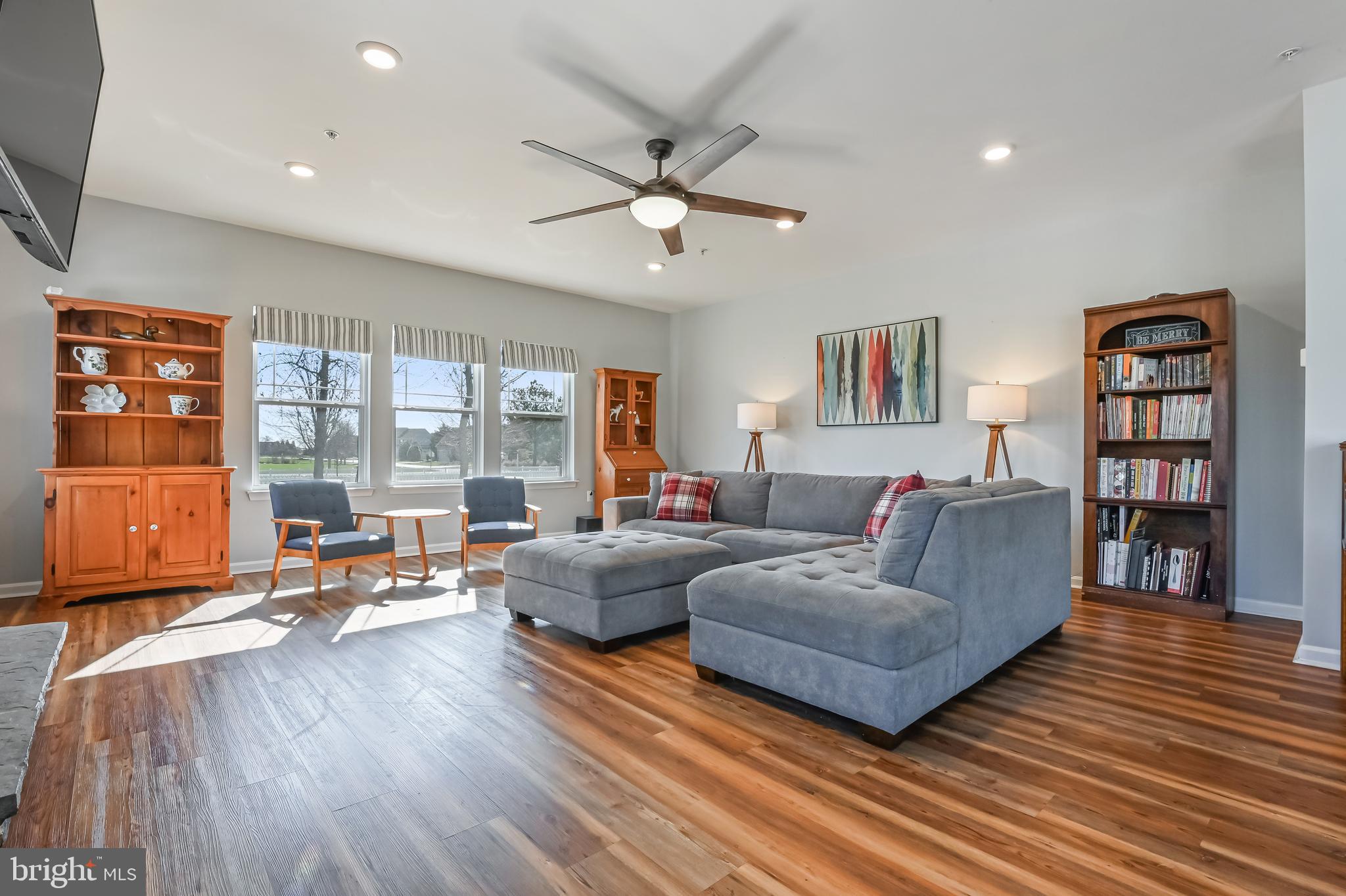 5559 Trafalgar Circle Tilghman, MD 21671 - Photo 25 of 62 a living room with furniture and a floor to ceiling window