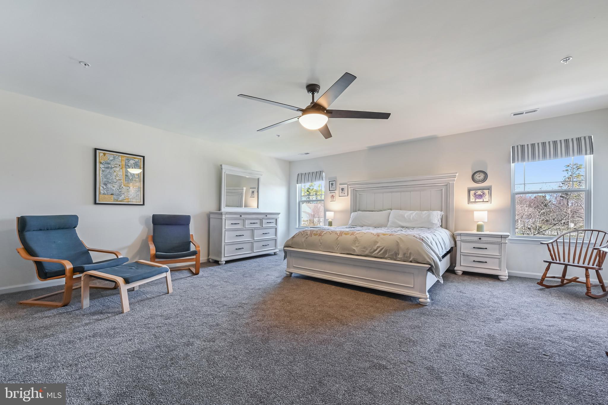 5559 Trafalgar Circle Tilghman, MD 21671 - Photo 28 of 62 a bedroom with a bed a chair and a chandelier