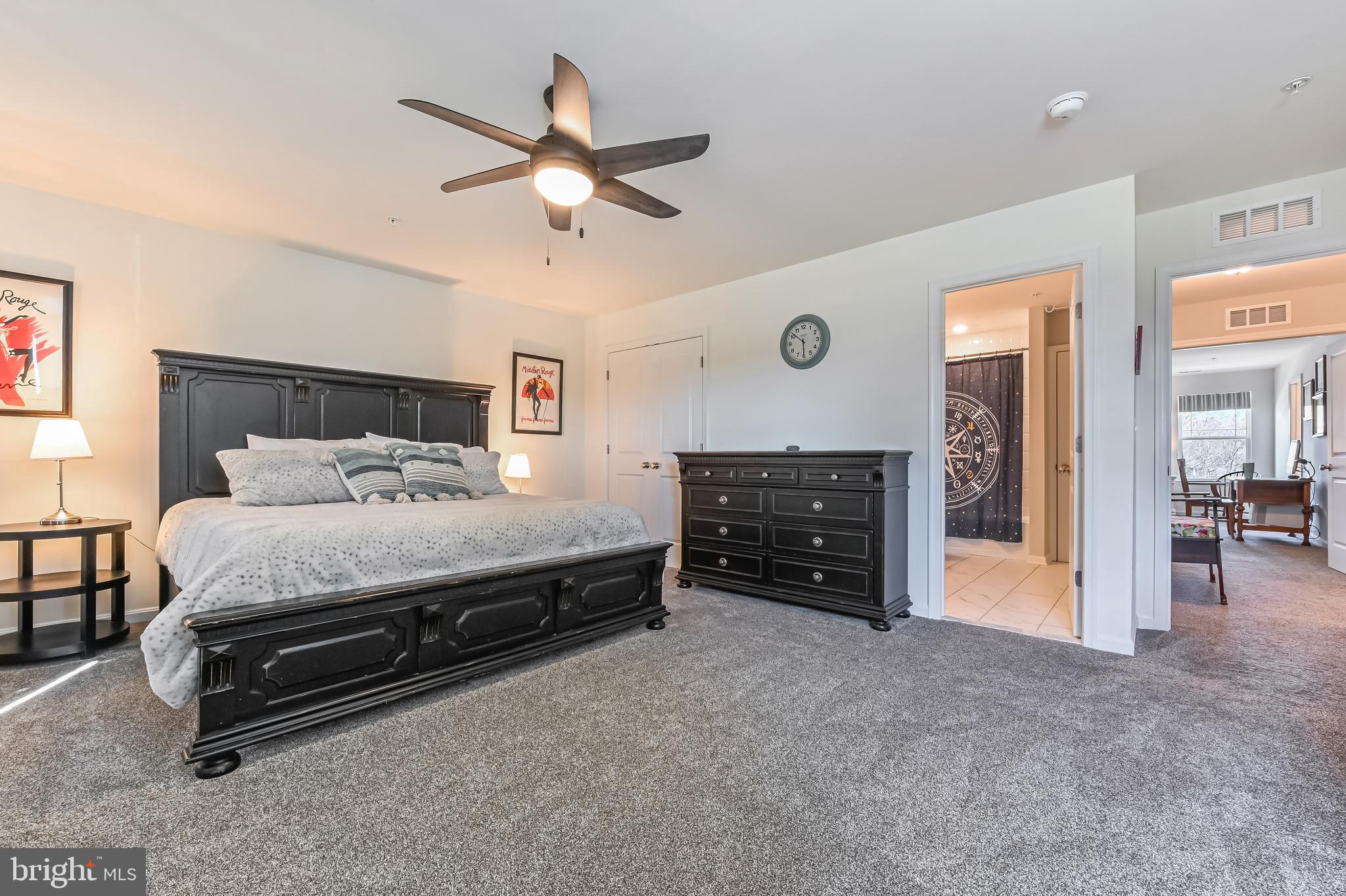 5559 Trafalgar Circle Tilghman, MD 21671 - Photo 37 of 62 a bedroom with a bed and a chandelier