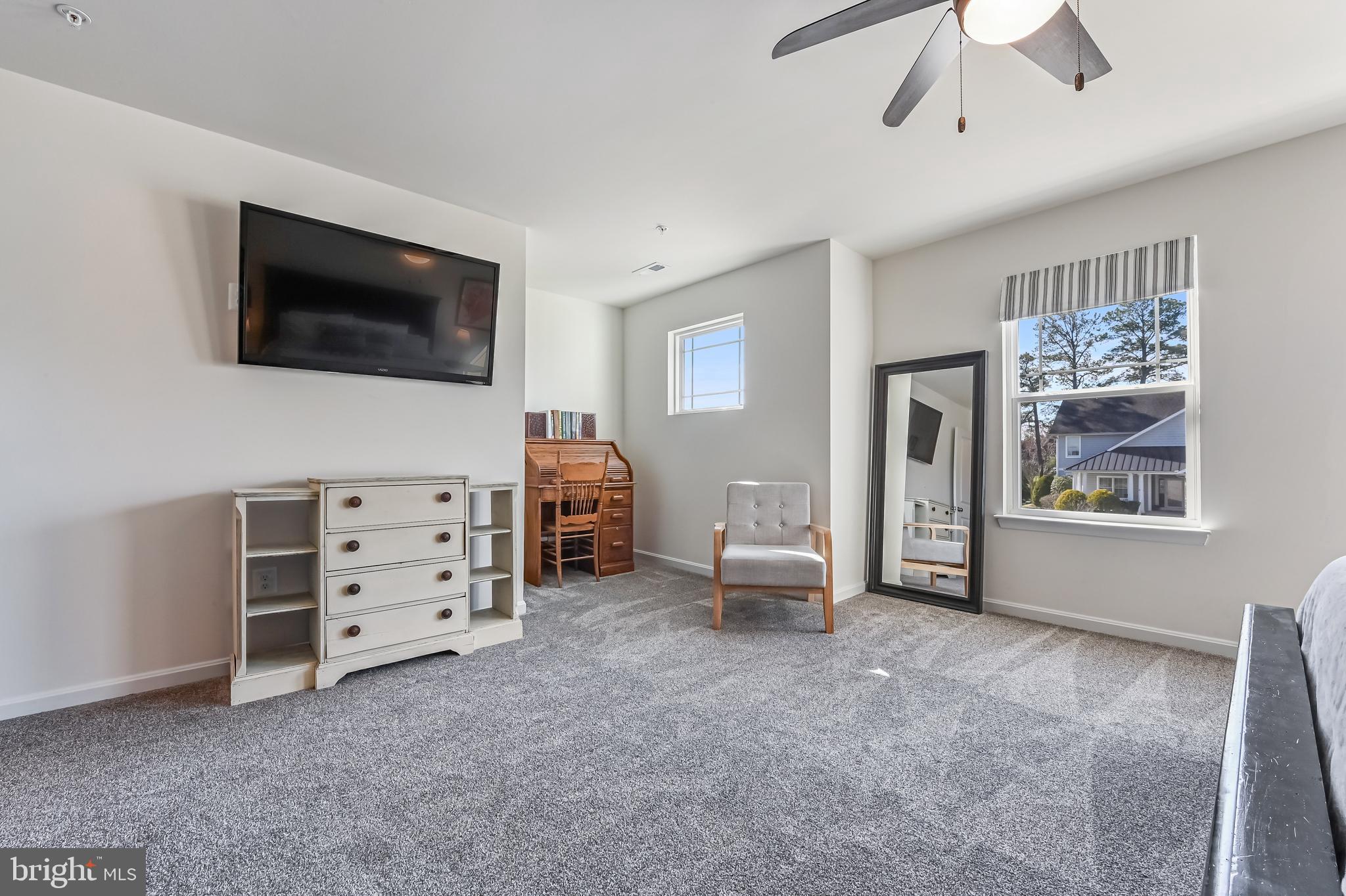 5559 Trafalgar Circle Tilghman, MD 21671 - Photo 38 of 62 a living room with furniture and a flat screen tv