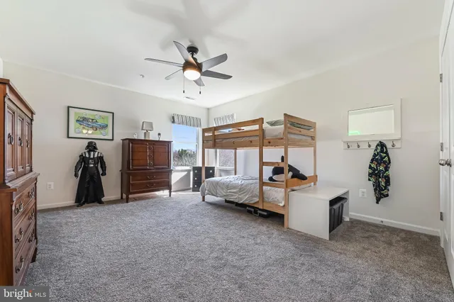 a bedroom with furniture and window