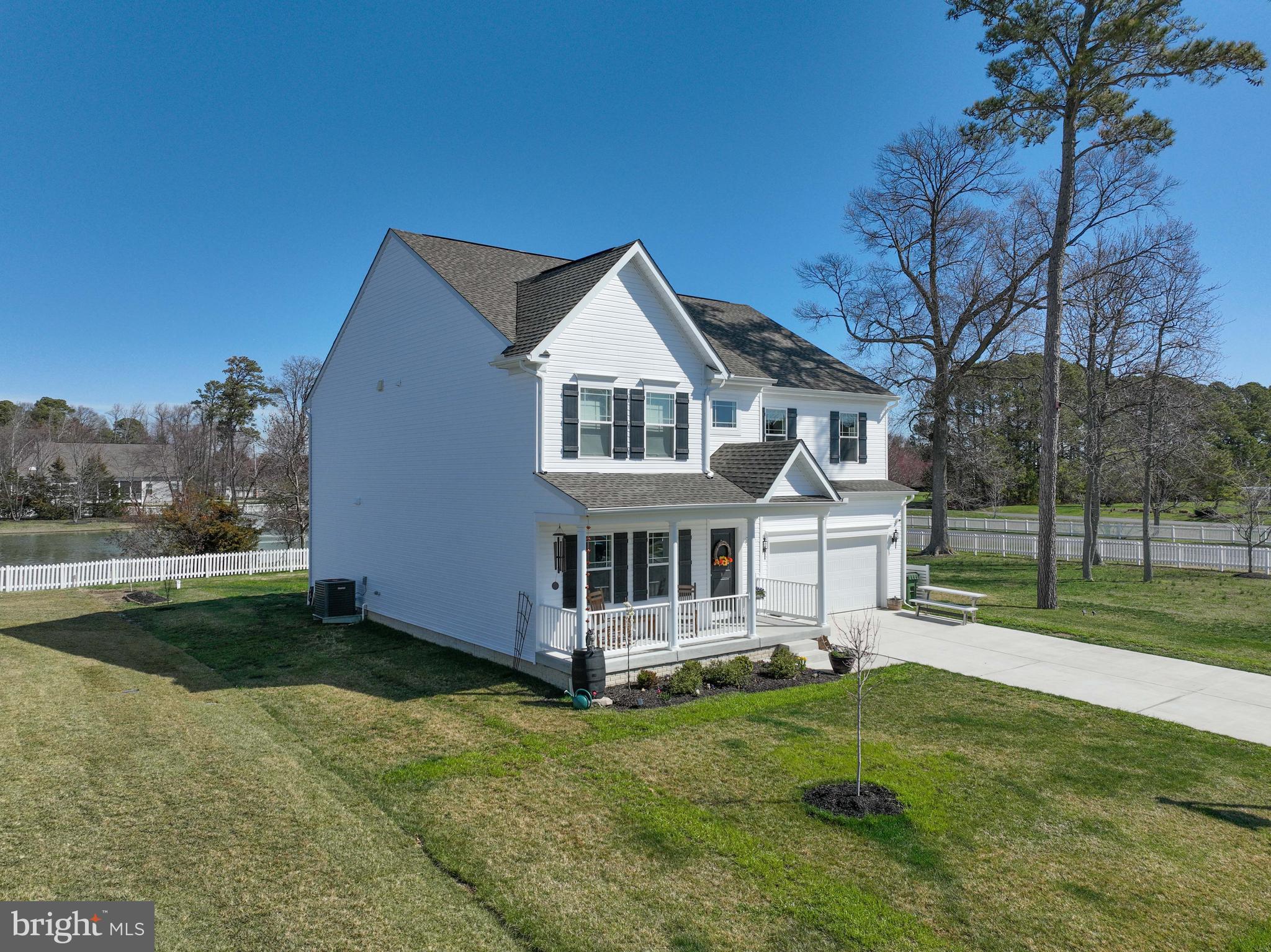 5559 Trafalgar Circle Tilghman, MD 21671 - Photo 4 of 62 a front view of a house with garden