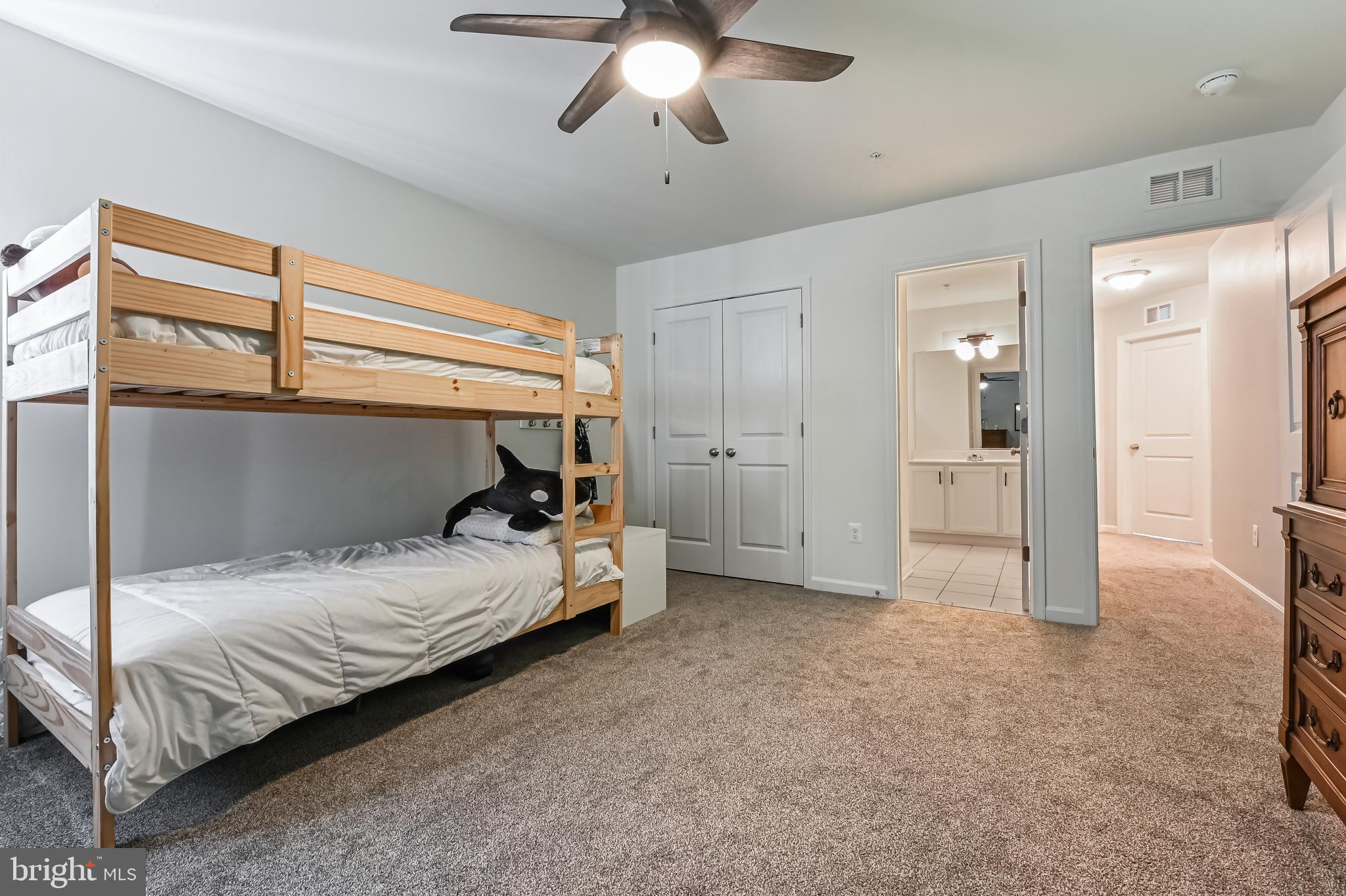 5559 Trafalgar Circle Tilghman, MD 21671 - Photo 41 of 62 a bedroom with a bed and a chandelier