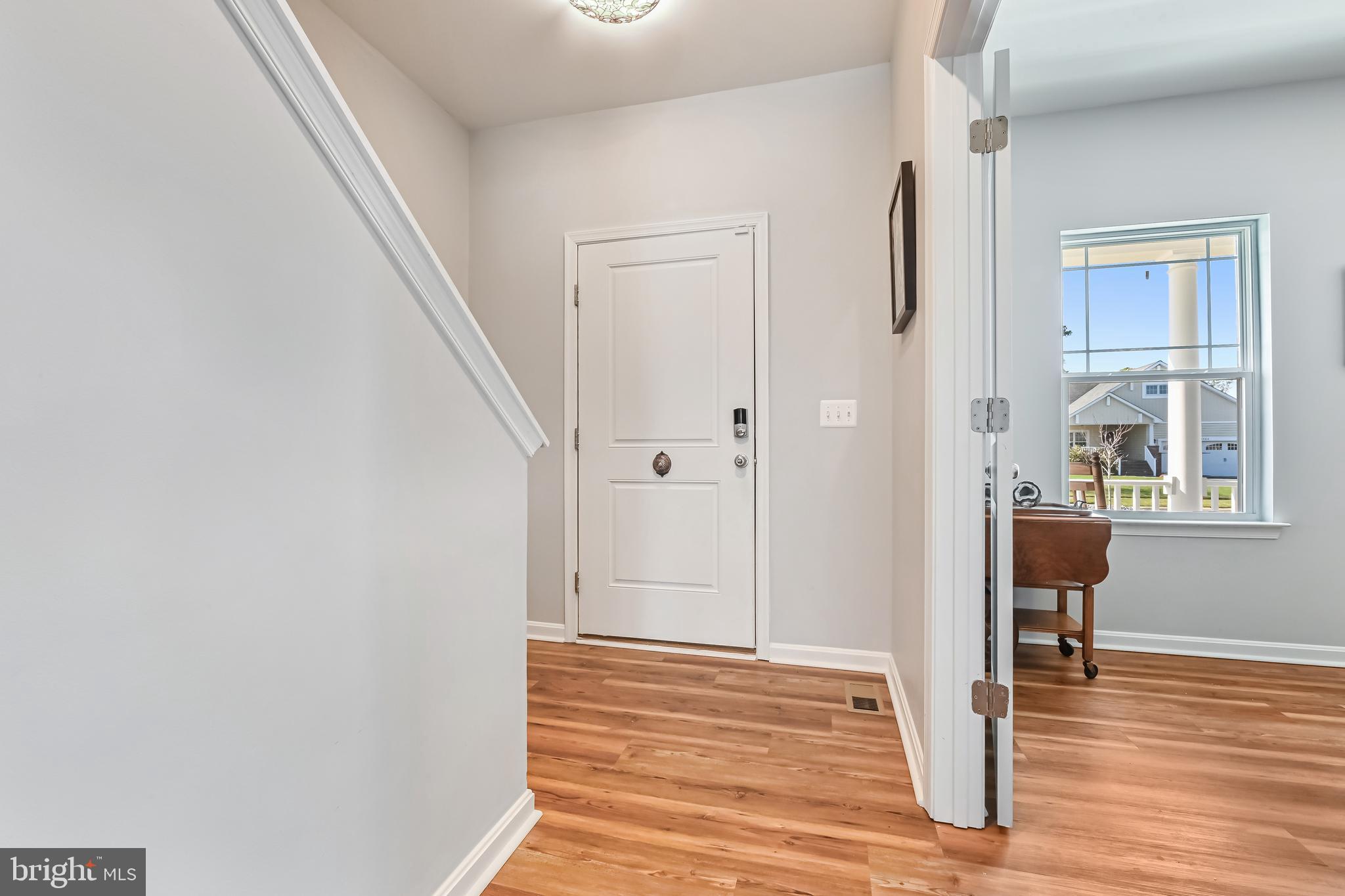 5559 Trafalgar Circle Tilghman, MD 21671 - Photo 5 of 62 a view of a livingroom with wooden floor and a window