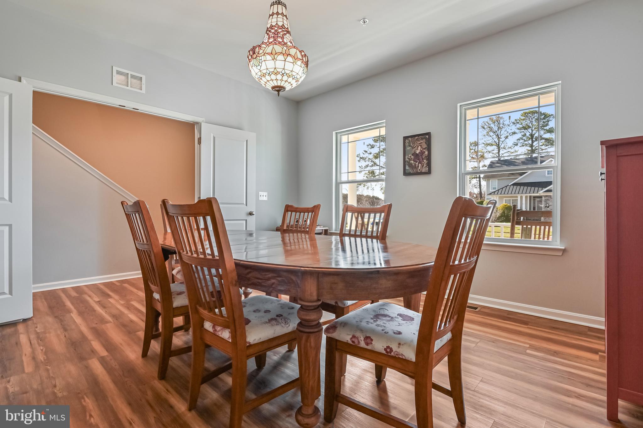 5559 Trafalgar Circle Tilghman, MD 21671 - Photo 8 of 62 a view of a dining room with furniture and wooden floor