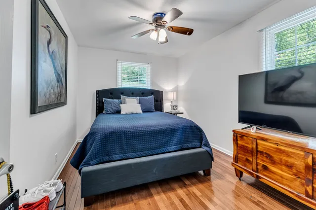 a bedroom with a bed and window