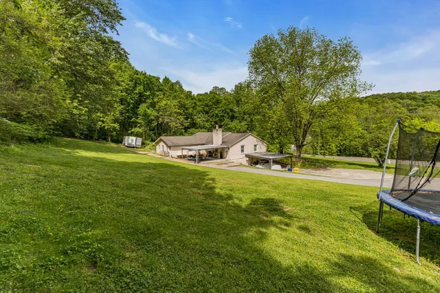 a view of a swimming pool with a patio