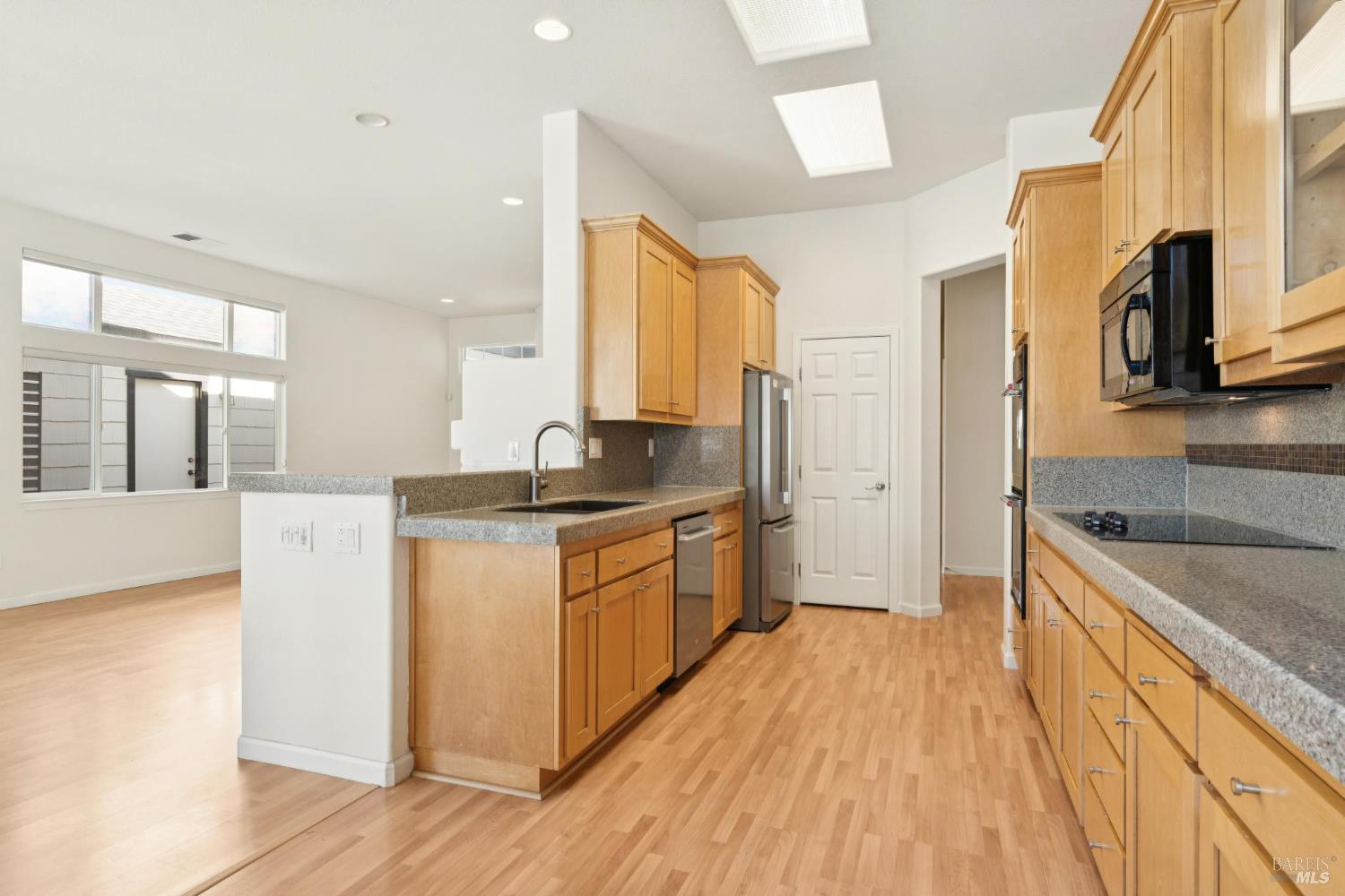 6471 Pine Valley Drive Santa Rosa, CA 95409 - Photo 12 of 48 a kitchen with stainless steel appliances granite countertop a sink stove and refrigerator