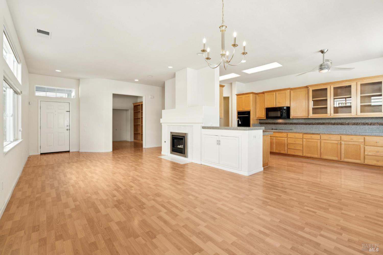 6471 Pine Valley Drive Santa Rosa, CA 95409 - Photo 13 of 48 a view of a kitchen with a sink and dishwasher a refrigerator with wooden floor