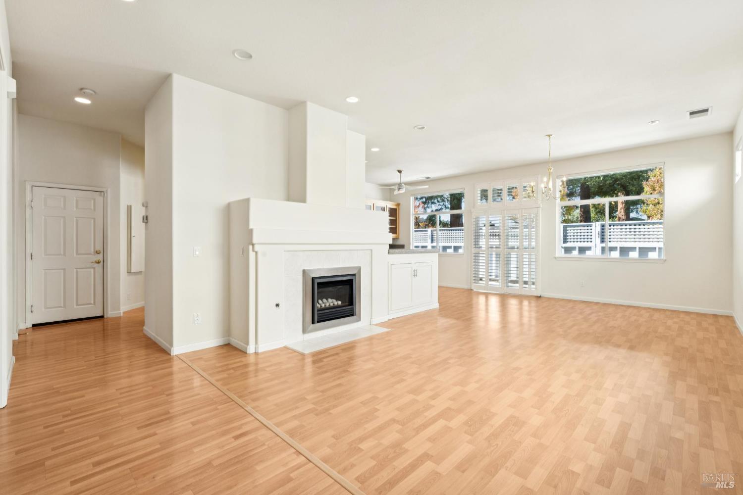 6471 Pine Valley Drive Santa Rosa, CA 95409 - Photo 23 of 48 a view of empty room with wooden floor and fireplace