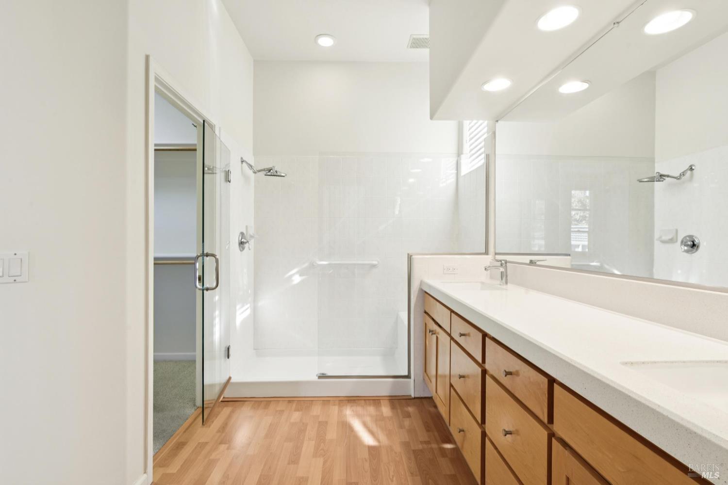 6471 Pine Valley Drive Santa Rosa, CA 95409 - Photo 27 of 48 a bathroom with a sink a mirror and a shower