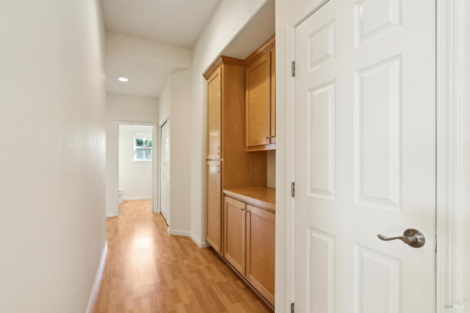 6471 Pine Valley Drive Santa Rosa, CA 95409 - Photo 30 of 48 a view of a hallway with wooden floor and a bathroom
