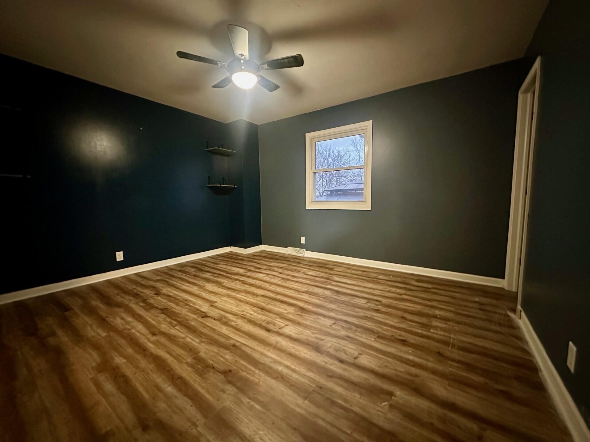 3907 Brookside Drive Crown Point, IN 46307 - Photo 15 of 22 a bedroom with a bed and a chandelier