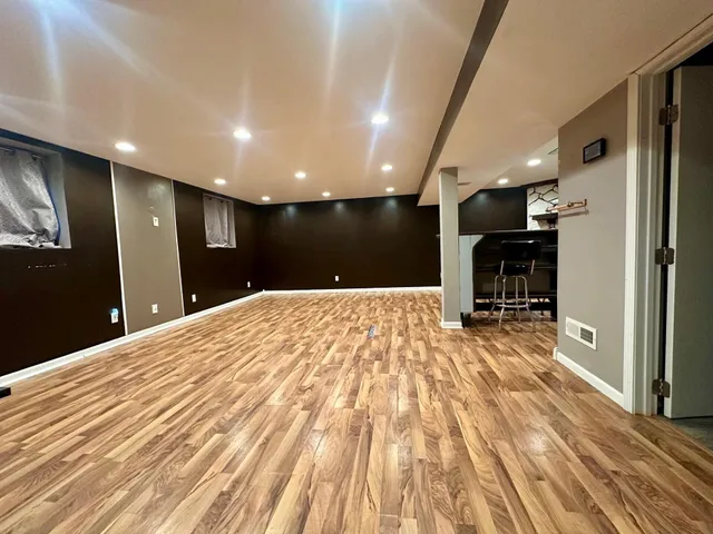 a spacious bathroom with a sink and a mirror