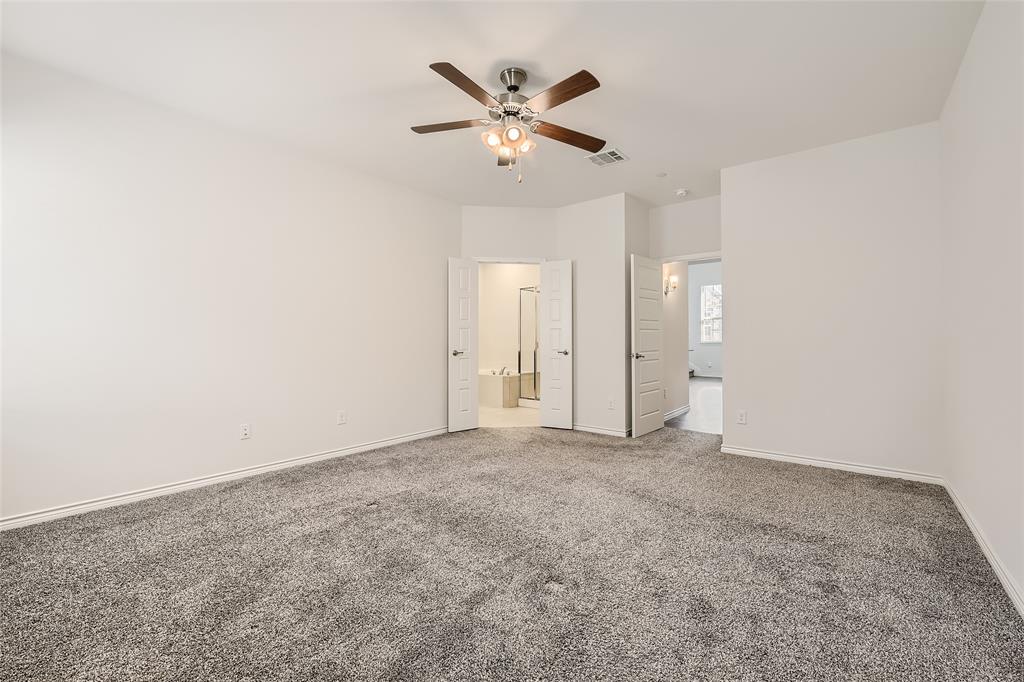 2407 Siskiyou Street Lewisville, TX 75056 - Photo 20 of 31 an empty room with closet and ceiling fan
