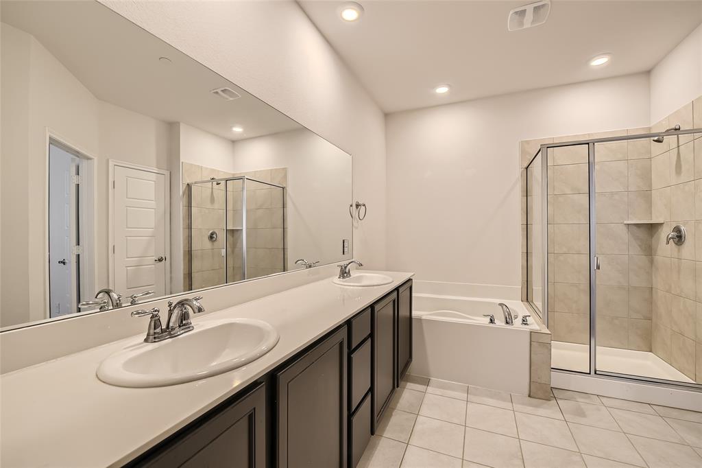 2407 Siskiyou Street Lewisville, TX 75056 - Photo 22 of 31 a bathroom with a double vanity sink mirror and toilet