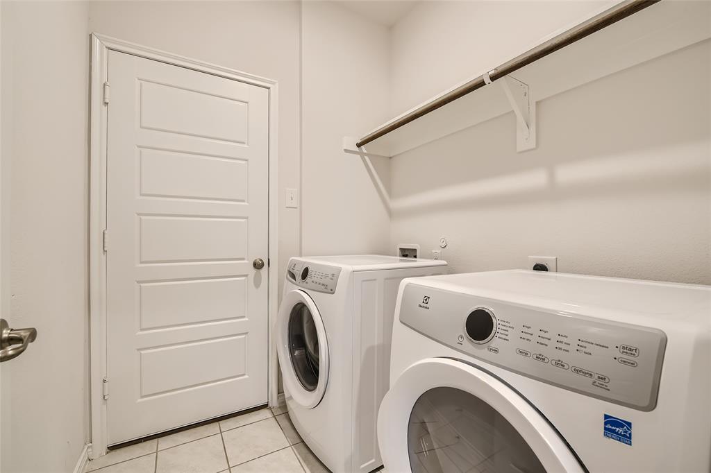 2407 Siskiyou Street Lewisville, TX 75056 - Photo 28 of 31 a utility room with dryer and washer