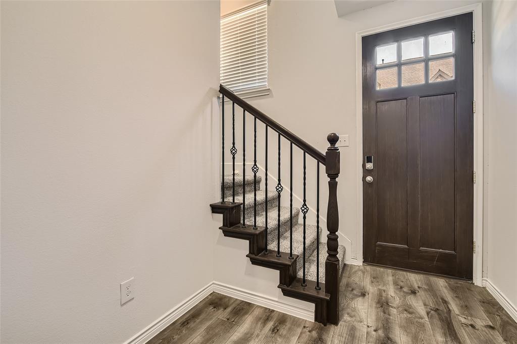 2407 Siskiyou Street Lewisville, TX 75056 - Photo 4 of 31 a view of entryway with wooden floor and stairs