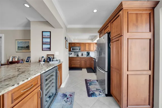 a en suite bathroom with a granite countertop sink and a mirror