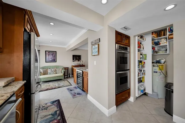 a view of a livingroom with furniture and staircase