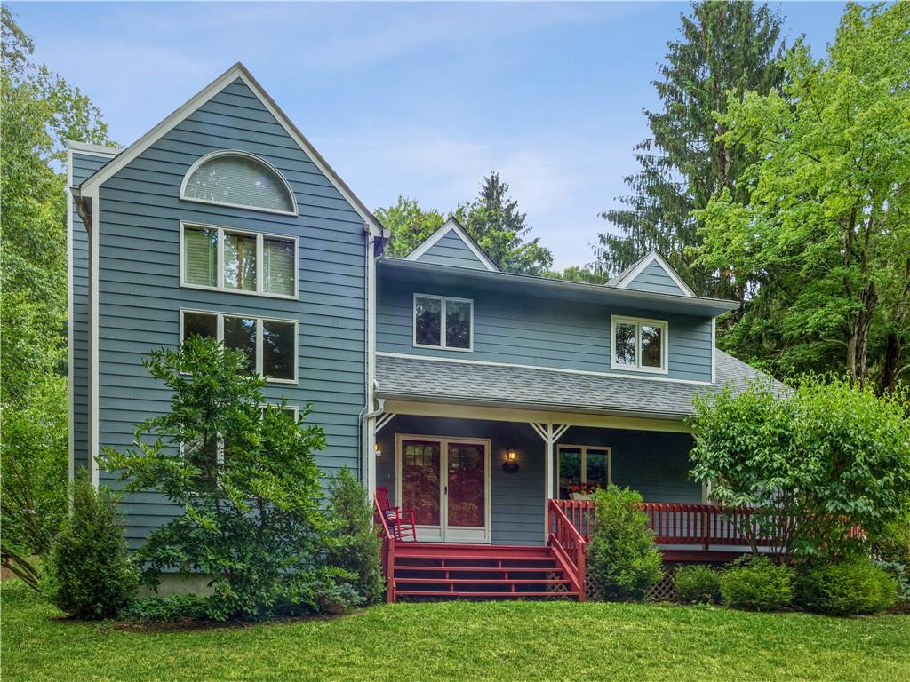 291 Indian Brook Road Garrison, NY 10524 - Photo 1 of 1 a front view of a house with garden