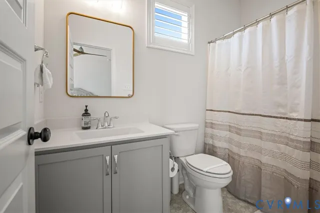 a spacious bedroom with a bed and a window