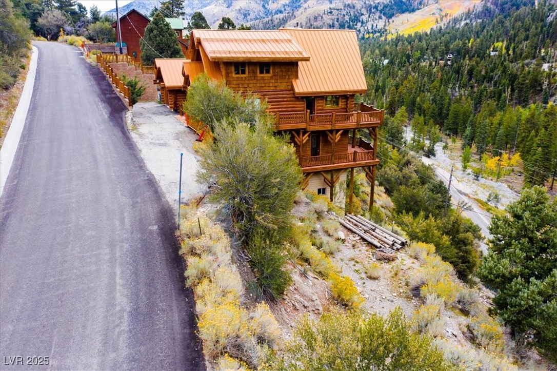 4925 Spruce Road Las Vegas, NV 89124 - Photo 12 of 49 Drone / aerial view of a mountain backdrop