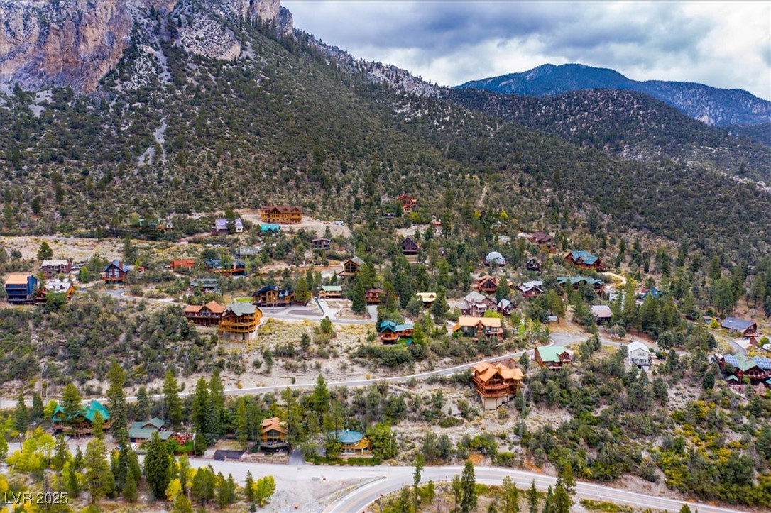 4925 Spruce Road Las Vegas, NV 89124 - Photo 44 of 49 Aerial perspective of suburban area featuring a mountain backdrop